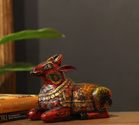Wooden Nandi statue side view – vibrant hand-painted floral motifs India