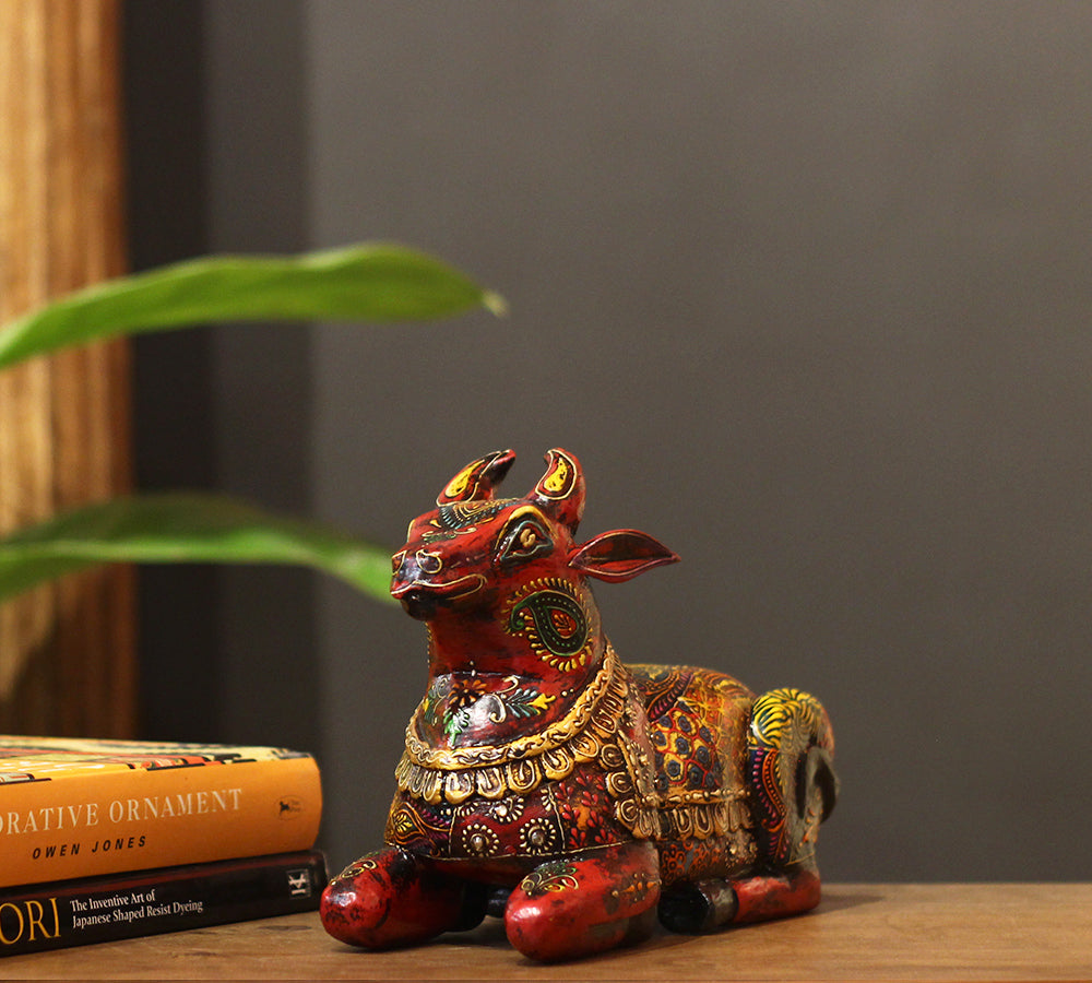 Wooden Nandi statue side view – vibrant hand-painted floral motifs India
