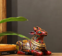 Intricate hand-painted floral motifs on wooden Nandi statue – CottageArts India