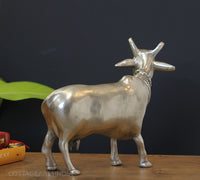 Handcrafted brass sacred cow sculpture silver finish back view