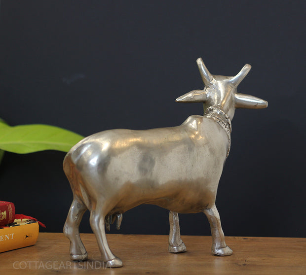 Handcrafted brass sacred cow sculpture silver finish back view