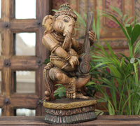 Handcrafted Wooden Lord Ganesha Playing Veena – Vintage Antique Finish