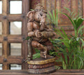Handcrafted Wooden Lord Ganesha Playing Mridangam – Vintage Antique Finish