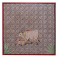 Decorative panel with a cow and calf design on a geometric patterned background