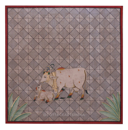 Decorative panel with a cow and calf design on a geometric patterned background