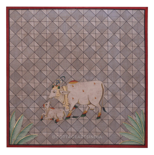 Decorative panel with a cow and calf design on a geometric patterned background