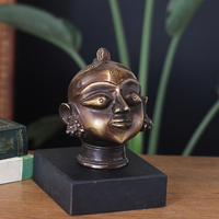 Brass Gauri Head Antique Finish on Wooden Stand