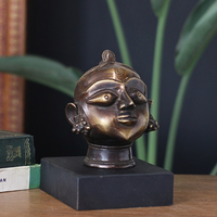 Brass Gauri Head Antique Finish on Wooden Stand