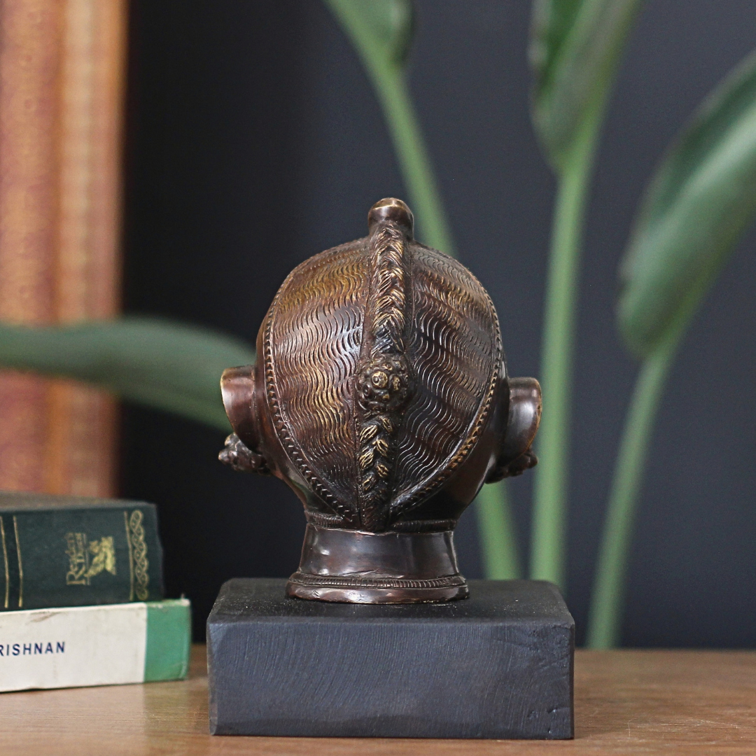 Brass Gauri Head Antique Finish on Wooden Stand