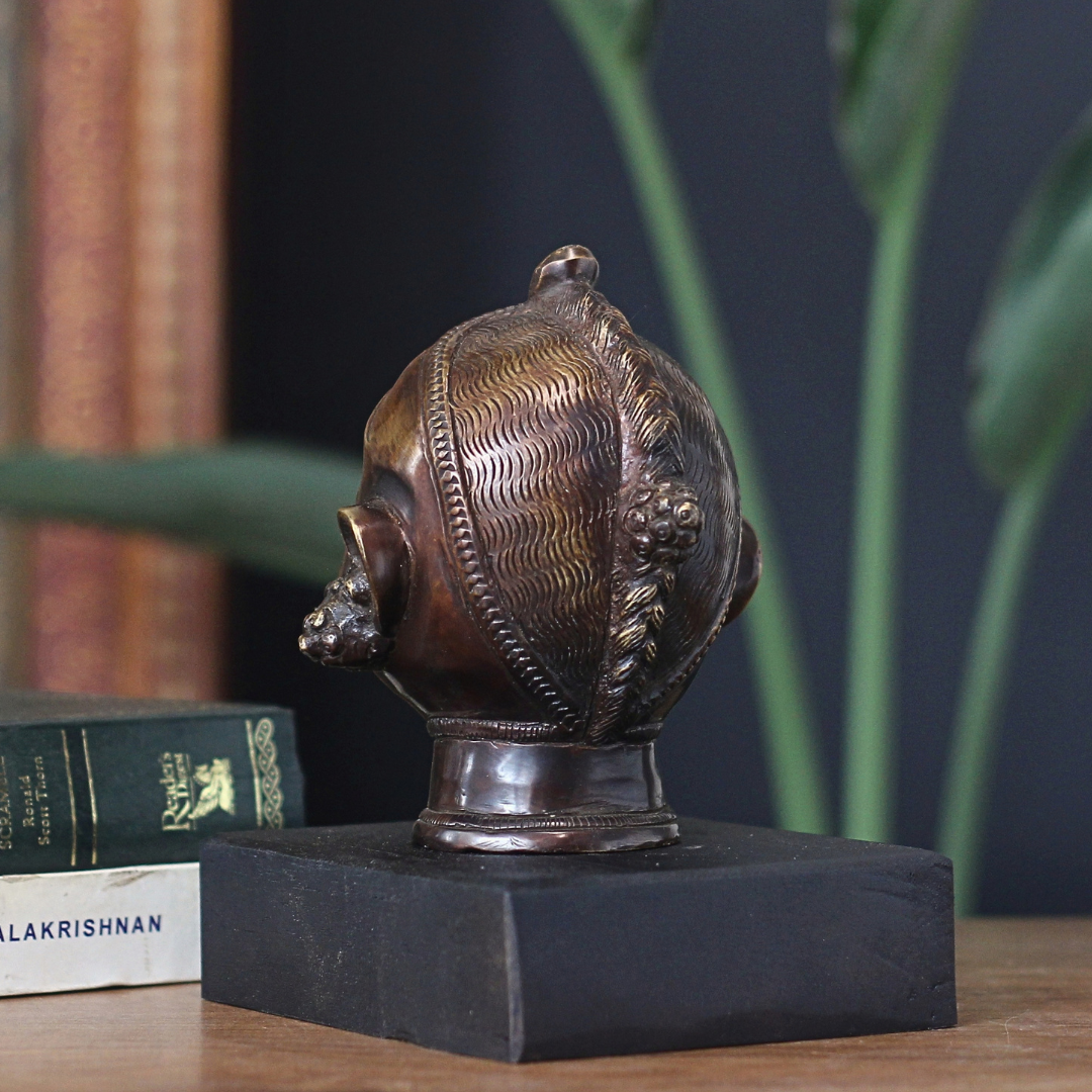 Brass Gauri Head Antique Finish on Wooden Stand