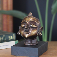 Brass Gauri Head Antique Finish on Wooden Stand