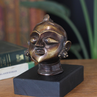 Brass Gauri Head Antique Finish on Wooden Stand