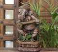 Handcrafted Wooden Lord Ganesha Playing Veena – Vintage Antique Finish