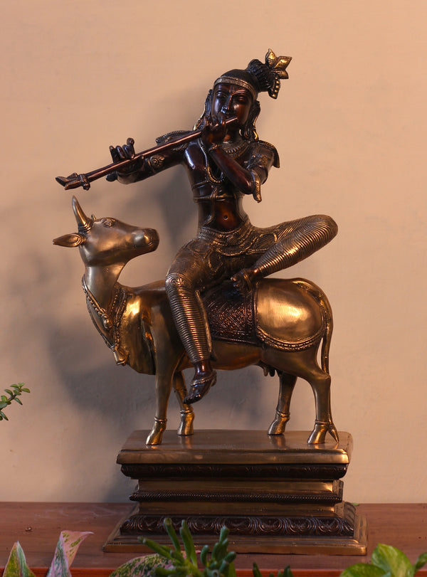 Brass Krishna Sitting On Cow
