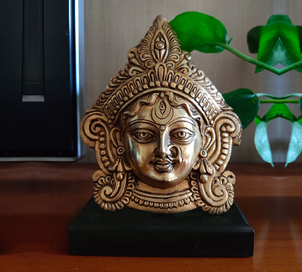 Brass Durga Face Mask On Wood