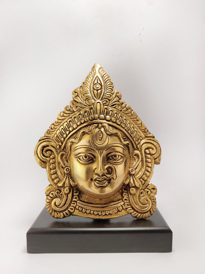 Brass Durga Face Mask On Wood